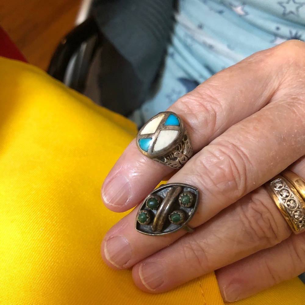 Ring used in a pinky with blue and white stone